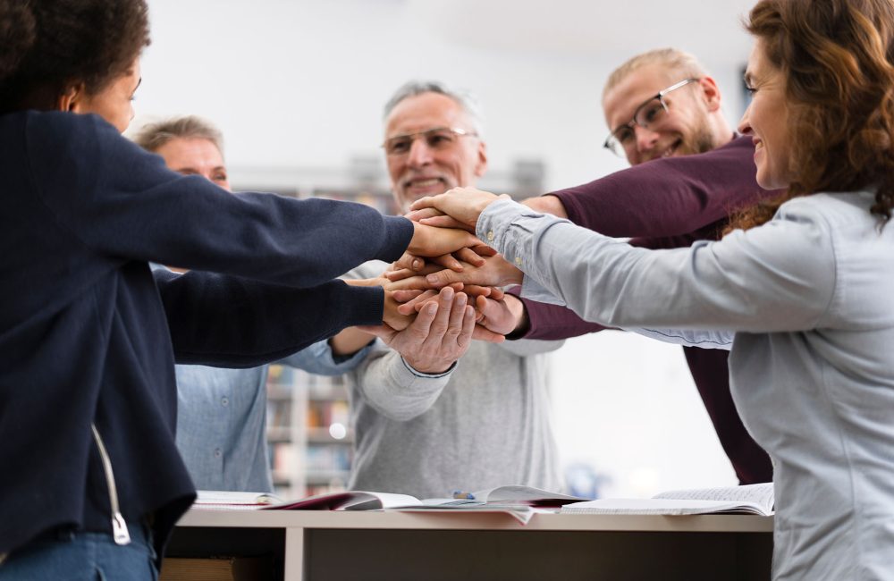 4 close-up-people-holding-hands-together